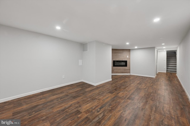 1408 N Redfield St, Philadelphia, PA 19151 - finished basement featuring recessed lighting, stairs, dark wood finished floors, and a fireplace