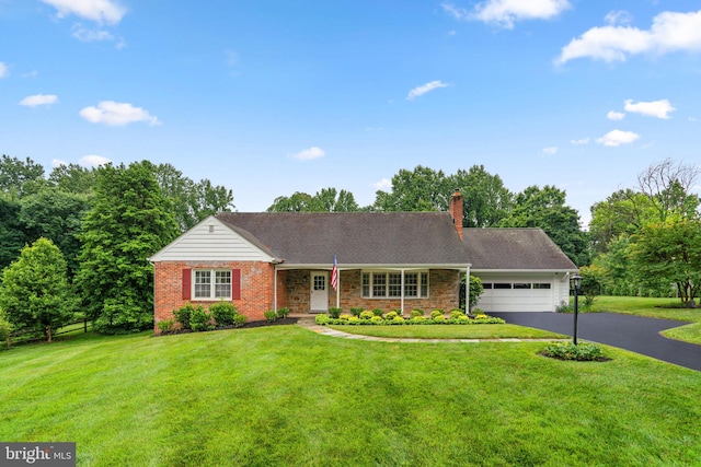10833 Hunting Ln, Columbia, MD 21044 - view of front of house with an attached garage, asphalt driveway, a chimney, and brick siding