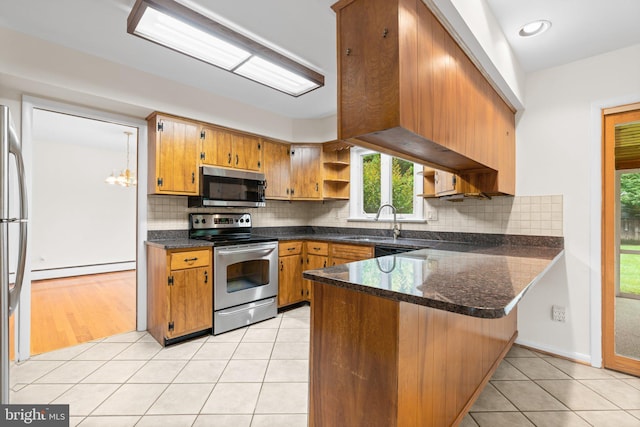 10833 Hunting Ln, Columbia, MD 21044 - kitchen with stainless steel appliances, open shelves, a peninsula, brown cabinets, and light tile patterned floors