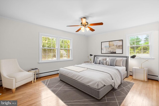 10833 Hunting Ln, Columbia, MD 21044 - bedroom featuring a baseboard radiator, crown molding, and light wood finished floors