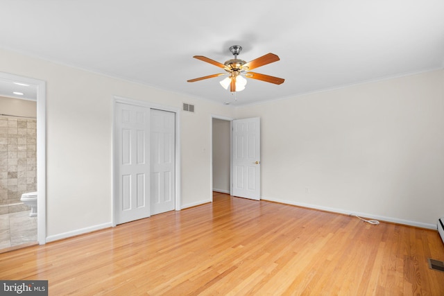 10833 Hunting Ln, Columbia, MD 21044 - unfurnished bedroom with wood finished floors, a closet, ornamental molding, connected bathroom, and ceiling fan