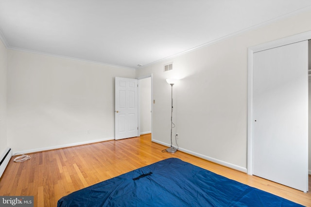 10833 Hunting Ln, Columbia, MD 21044 - unfurnished bedroom with wood finished floors and crown molding