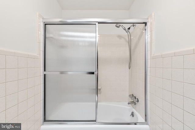 10833 Hunting Ln, Columbia, MD 21044 - bathroom with enclosed tub / shower combo, tile walls, and a wainscoted wall