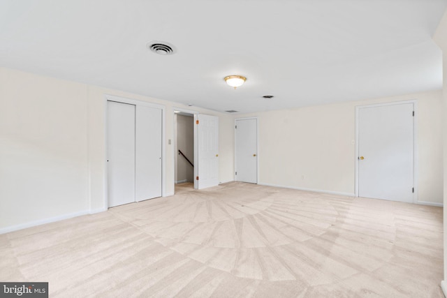 10833 Hunting Ln, Columbia, MD 21044 - unfurnished bedroom with multiple closets and light carpet