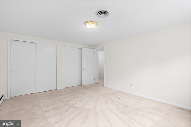 10833 Hunting Ln, Columbia, MD 21044 - unfurnished bedroom with two closets and carpet flooring