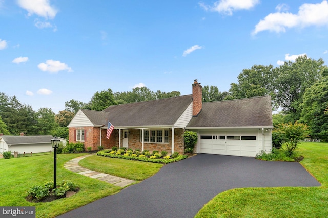 10833 Hunting Ln, Columbia, MD 21044 - view of front of home featuring asphalt driveway, a garage, a front yard, and a chimney