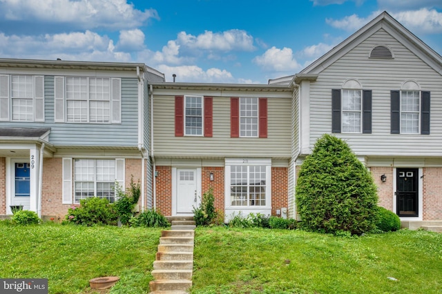211 Royal Oak Ct, Odenton, MD 21113 - townhome / multi-family property featuring brick siding and a front yard