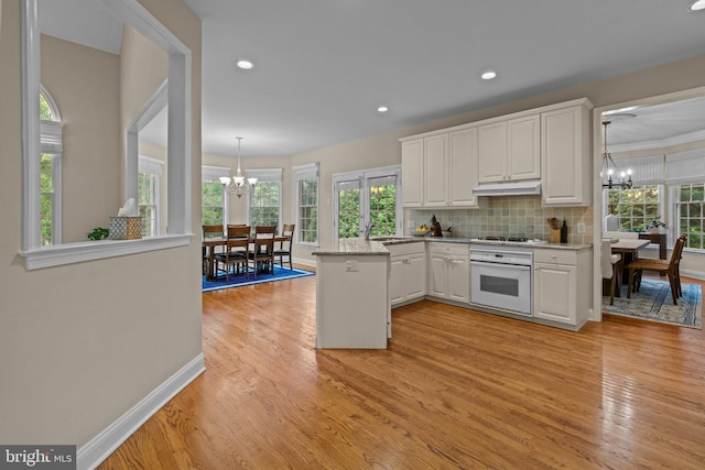 14 Leapson Ln, Doylestown, PA 18901 - kitchen with white oven, a chandelier, white cabinetry, light wood finished floors, and recessed lighting