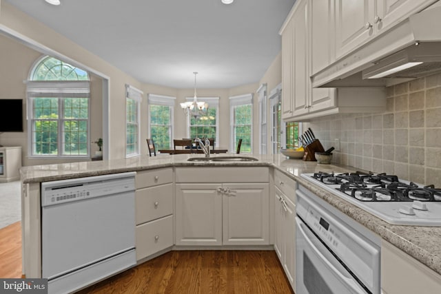 14 Leapson Ln, Doylestown, PA 18901 - kitchen featuring white appliances, under cabinet range hood, a chandelier, white cabinets, and dark wood-style floors