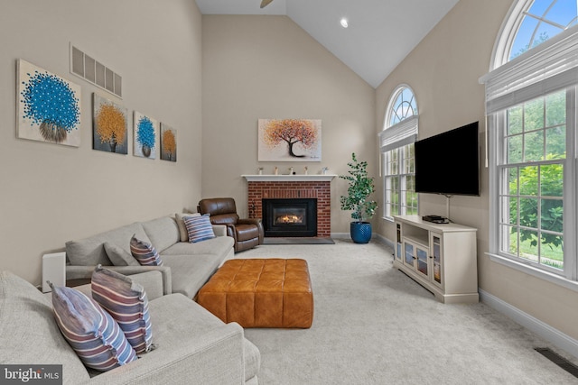 14 Leapson Ln, Doylestown, PA 18901 - carpeted living room featuring high vaulted ceiling, a brick fireplace, and ceiling fan