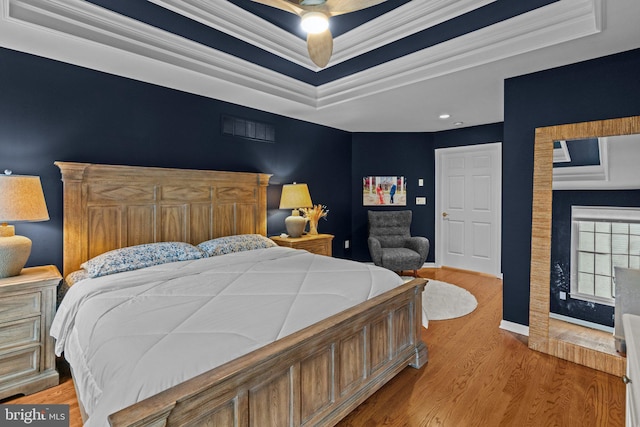 14 Leapson Ln, Doylestown, PA 18901 - bedroom featuring a tray ceiling, light wood-type flooring, and ornamental molding