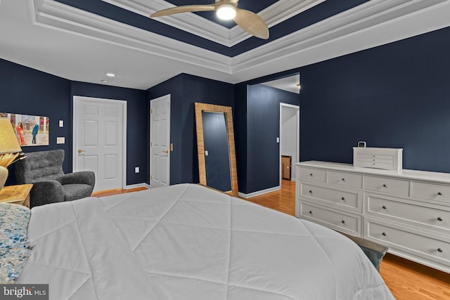 14 Leapson Ln, Doylestown, PA 18901 - bedroom with light wood-style flooring, a raised ceiling, ornamental molding, and a ceiling fan