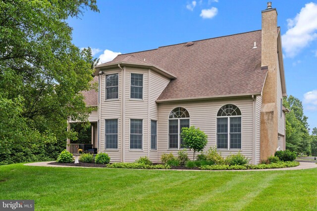 14 Leapson Ln, Doylestown, PA 18901 - view of front facade with a chimney, a front yard, and a shingled roof