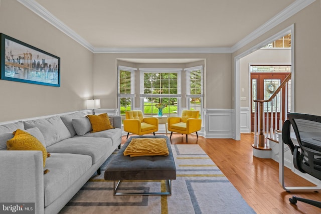 14 Leapson Ln, Doylestown, PA 18901 - living area featuring crown molding, wood finished floors, and a wainscoted wall