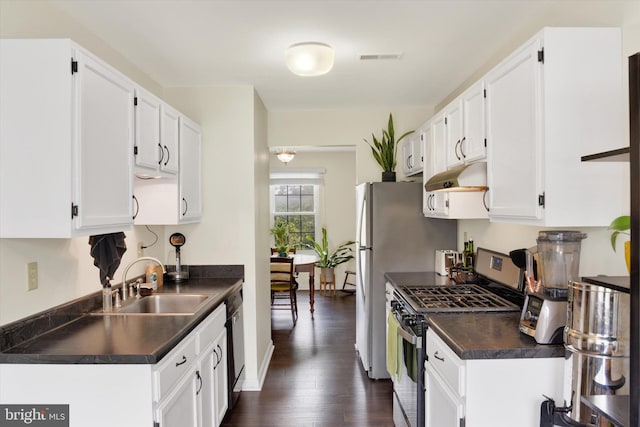 6222 Spring Knoll Dr, Harrisburg, PA 17111 - kitchen with stainless steel range with gas cooktop, dark countertops, and white cabinetry