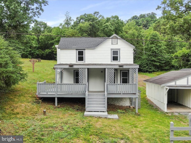 667 Thompson Rd, Needmore, PA 17238 - view of front of house with a front yard, a porch, stairs, and a forest view