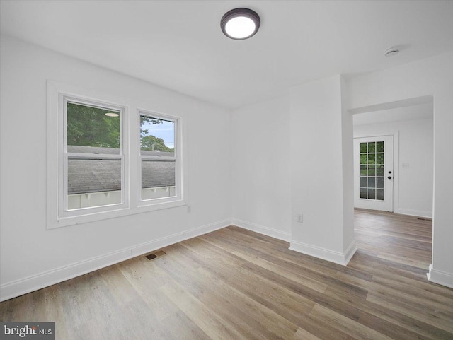 667 Thompson Rd, Needmore, PA 17238 - unfurnished room featuring healthy amount of natural light, wood finished floors, and a smoke detector
