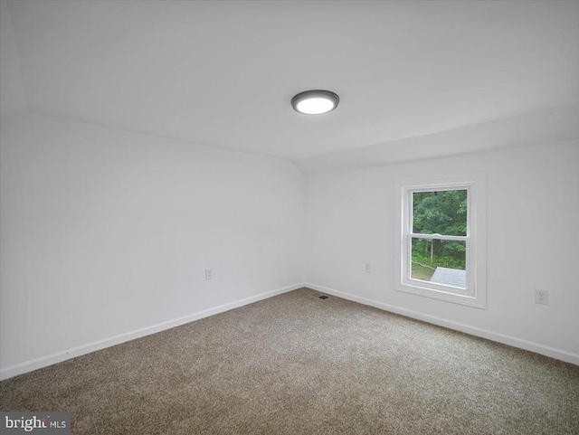 667 Thompson Rd, Needmore, PA 17238 - carpeted empty room with vaulted ceiling and baseboards