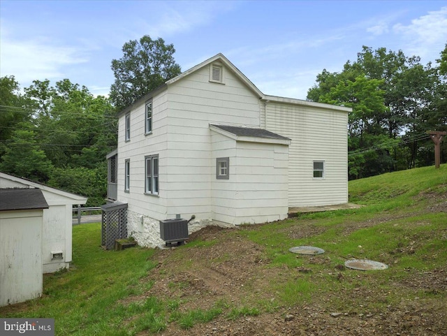 667 Thompson Rd, Needmore, PA 17238 - view of side of property featuring a yard and a central AC unit