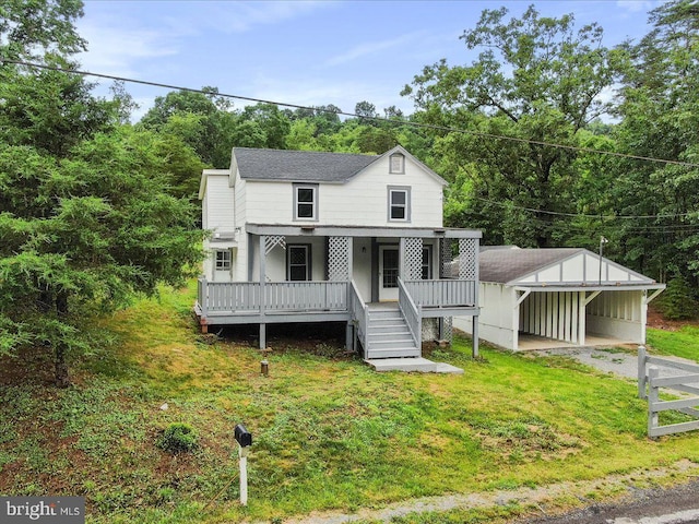 667 Thompson Rd, Needmore, PA 17238 - view of front facade featuring a front yard, driveway, covered porch, and a carport
