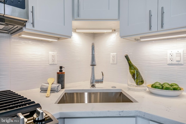 4901 1st St NW Unit 5, Washington, DC 20011 - kitchen featuring decorative backsplash and light stone countertops