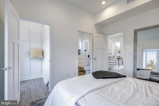 4901 1st St NW Unit 5, Washington, DC 20011 - bedroom featuring wood finished floors, recessed lighting, and ensuite bath