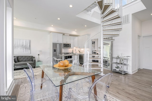 4901 1st St NW Unit 5, Washington, DC 20011 - dining space with light wood-style floors, recessed lighting, and stairs