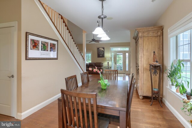 162 High Pointe Dr, Hummelstown, PA 17036 - dining area with light wood-style flooring, stairway, and a ceiling fan