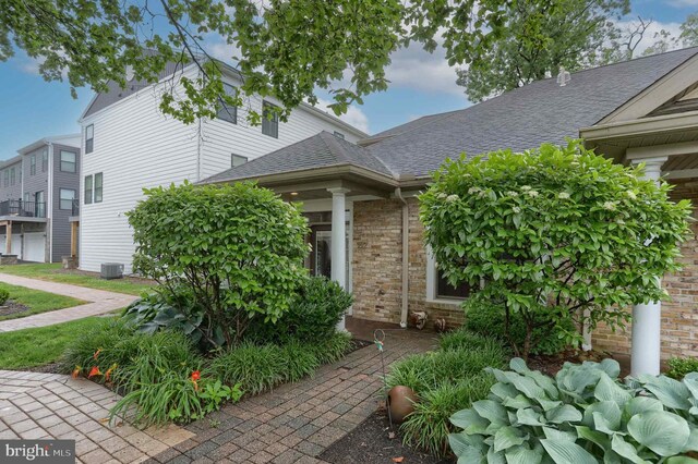 162 High Pointe Dr, Hummelstown, PA 17036 - doorway to property with roof with shingles and brick siding