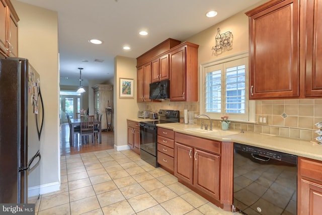 162 High Pointe Dr, Hummelstown, PA 17036 - kitchen featuring black appliances, backsplash, light countertops, recessed lighting, and light tile patterned floors
