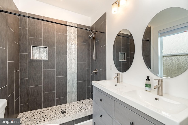 915 N Montford Ave, Baltimore, MD 21205 - bathroom with double vanity and tiled shower