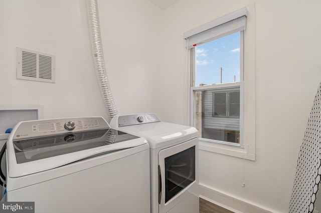 915 N Montford Ave, Baltimore, MD 21205 - laundry room with washer and clothes dryer and baseboards