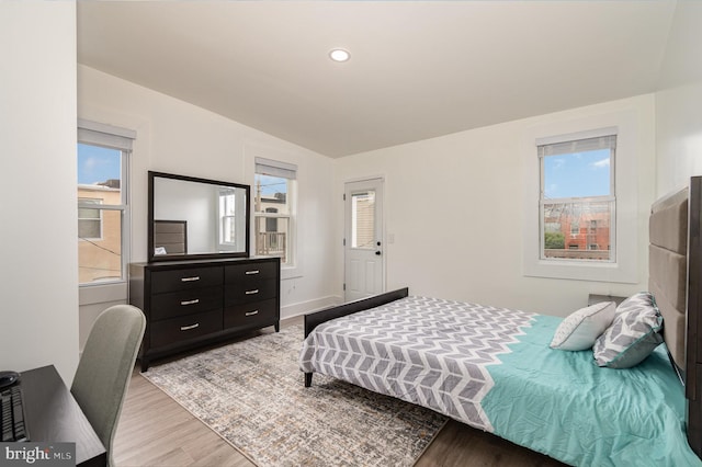 915 N Montford Ave, Baltimore, MD 21205 - bedroom with light wood-style flooring, vaulted ceiling, and recessed lighting
