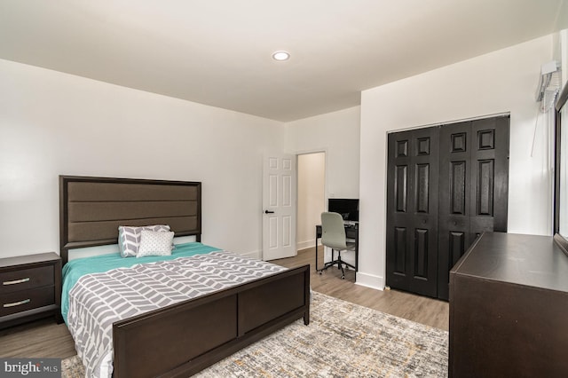 915 N Montford Ave, Baltimore, MD 21205 - bedroom featuring wood finished floors, a closet, a desk, and recessed lighting
