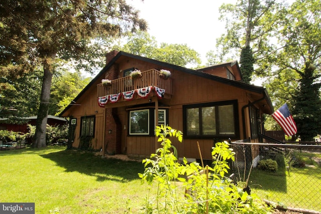 5 Chandler St, Browns Mills, NJ 08015 - view of front facade with a balcony and a chimney