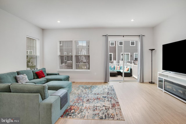 18351 Moss Garden Rd, Dumfries, VA 22026 - living area featuring healthy amount of natural light, wood finished floors, and recessed lighting