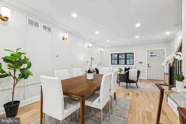 1310 E Passyunk Ave, Philadelphia, PA 19147 - dining space with crown molding, a decorative wall, light wood-type flooring, and recessed lighting