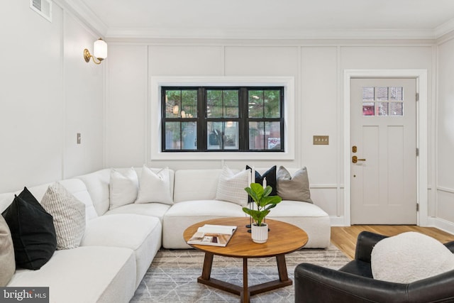 1310 E Passyunk Ave, Philadelphia, PA 19147 - living room with crown molding, wood finished floors, and a decorative wall