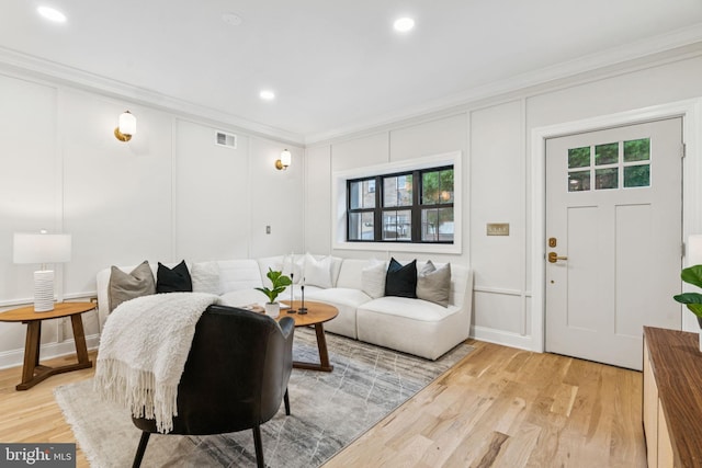1310 E Passyunk Ave, Philadelphia, PA 19147 - living room with crown molding, a decorative wall, healthy amount of natural light, light wood-style floors, and recessed lighting