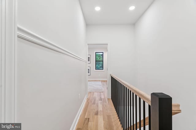 1310 E Passyunk Ave, Philadelphia, PA 19147 - hallway with light wood finished floors, recessed lighting, and an upstairs landing