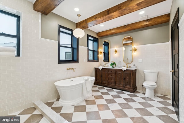 1310 E Passyunk Ave, Philadelphia, PA 19147 - full bathroom with plenty of natural light, tile walls, a freestanding bath, double vanity, and beamed ceiling