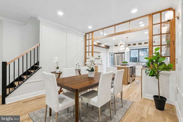 1310 E Passyunk Ave, Philadelphia, PA 19147 - dining area with stairs, light wood-style flooring, crown molding, and recessed lighting