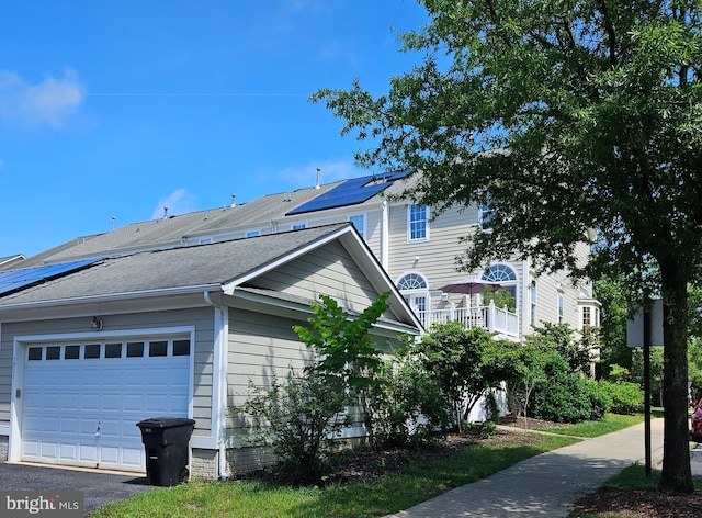 3835 Sugarloaf Pkwy, Frederick, MD 21704 - view of property exterior with roof mounted solar panels and a shingled roof