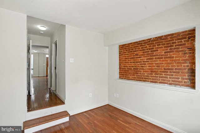 437 Pitman Pl, Baltimore, MD 21202 - unfurnished room with wood finished floors and baseboards
