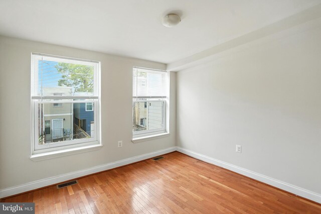 437 Pitman Pl, Baltimore, MD 21202 - empty room with light wood-style flooring and baseboards