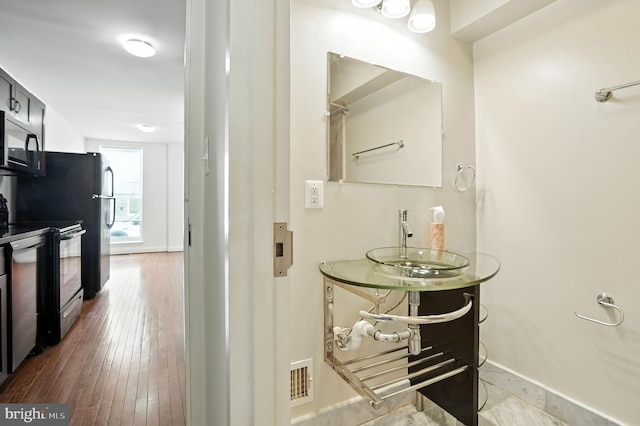 437 Pitman Pl, Baltimore, MD 21202 - bathroom with vanity and wood-type flooring