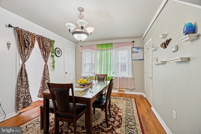 909 Walnut St, Lansdale, PA 19446 - dining space featuring a chandelier and wood finished floors