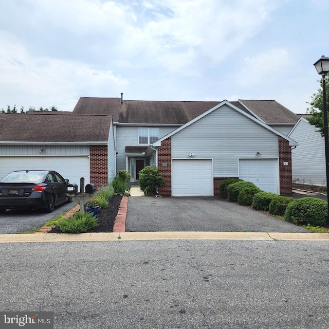 184 Steven Ln, Wilmington, DE 19808 - view of front of property featuring brick siding, asphalt driveway, a garage, and a shingled roof