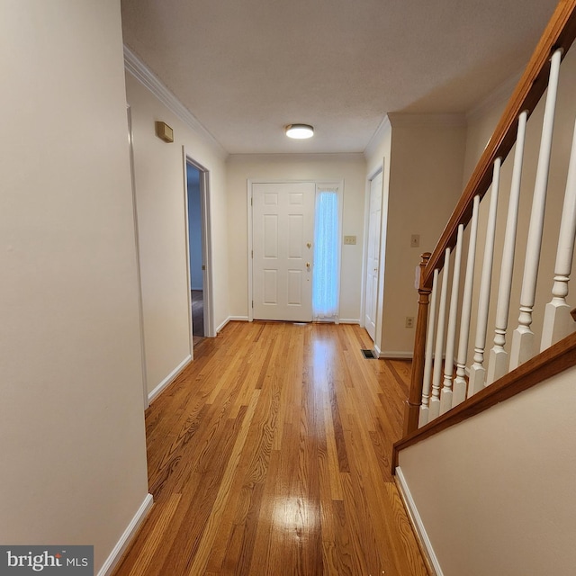 184 Steven Ln, Wilmington, DE 19808 - entrance foyer featuring light wood-style floors, crown molding, and stairway