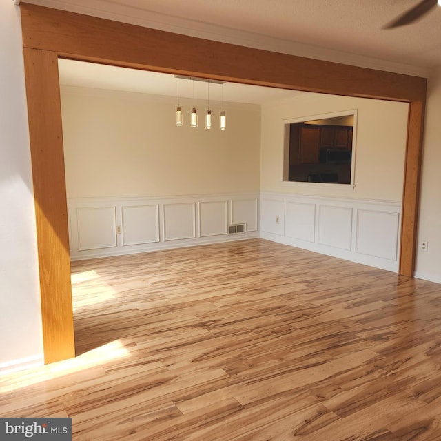 184 Steven Ln, Wilmington, DE 19808 - unfurnished living room featuring light wood finished floors and ornamental molding